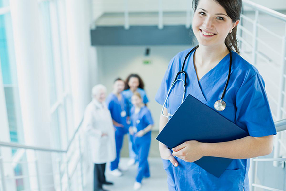 a nurse holds a clipboard with patient records