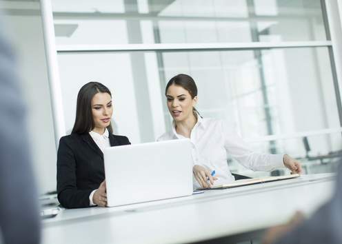 Two women collaborating on a project