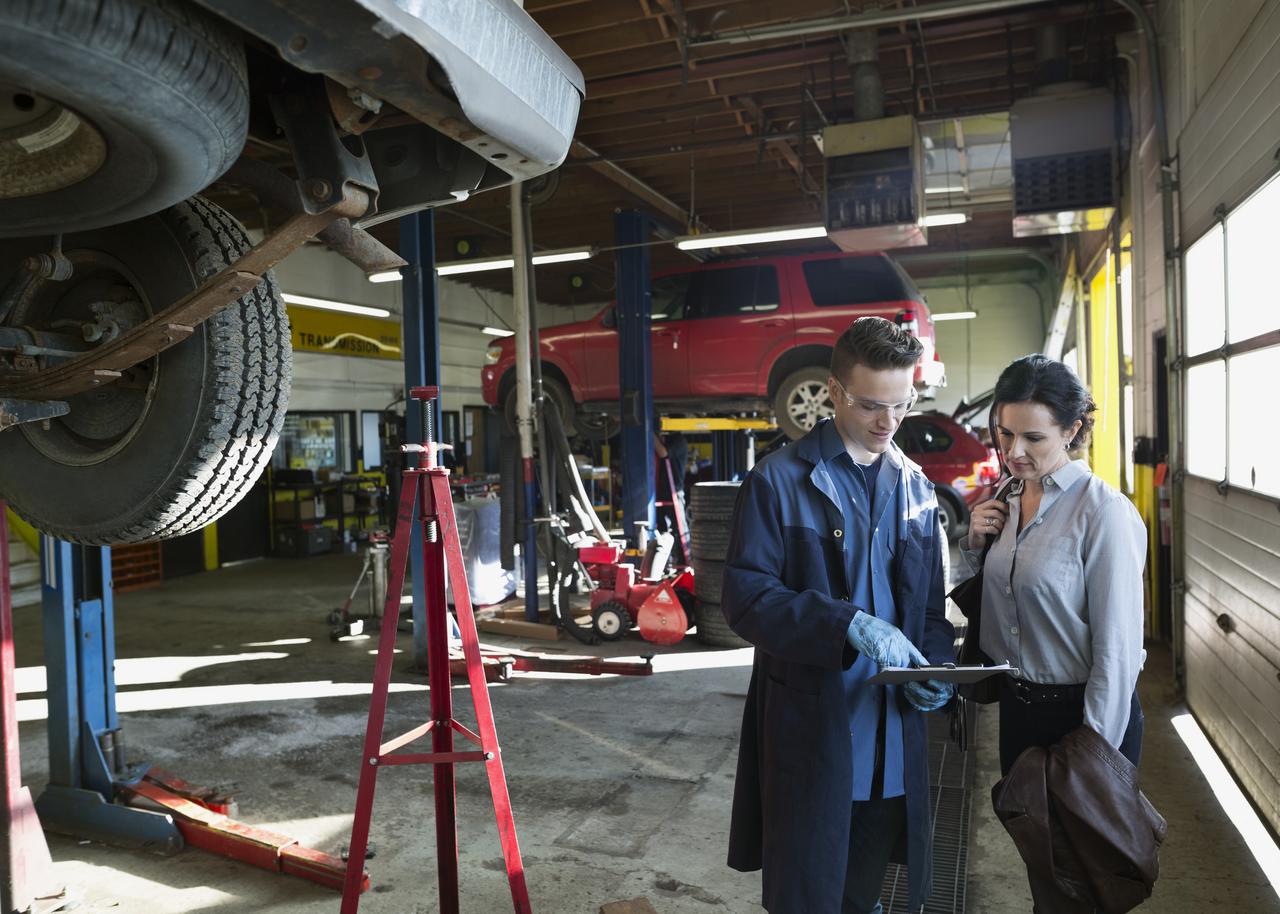 Two mechanics in their shop