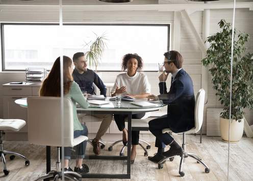 Group of business people working together around a table