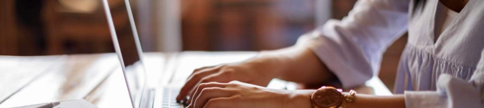 woman typing at a laptop